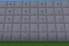 A wall of steel blocks with columns of steel rivets