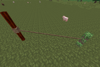 A creeper tethered to a nether brick fence post in MineClone 2
