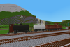 A pair of small tank wagons await departure from the yard.