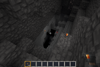 A player descending from the deepslate layer to the leagueschist layer