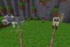 A cow and a sheep held on leads, while a sand monster is tethered to a post in the background