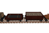 Side view of rake of freight train wagons: tree, track, gravel and lava wagons