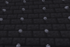 A wall of deepslate bricks with columns of steel rivets
